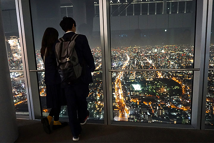  A couple enjoying the view of Osaka